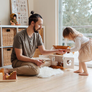 Father plays with young daughter